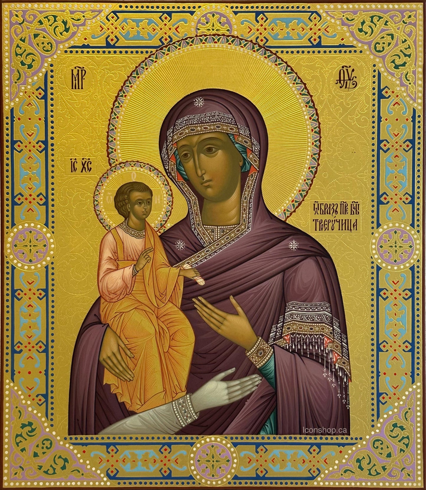 Hand painted icon of Mother of God on wooden board covered with gold leafs